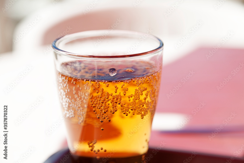 a cold beer in the summer heat at an outdoor restaurant a cold beer in the summer heat at an outdoor restaurant