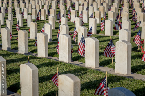 Military Headstones Decorated with Flags for Memorial Day