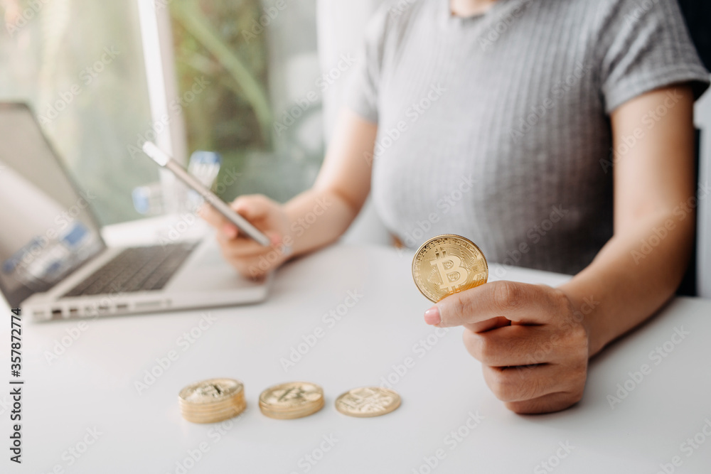 Fototapeta premium businesswoman holding coins putting in glass with using smartphone and calculator to calculate concept saving money for finance accounting