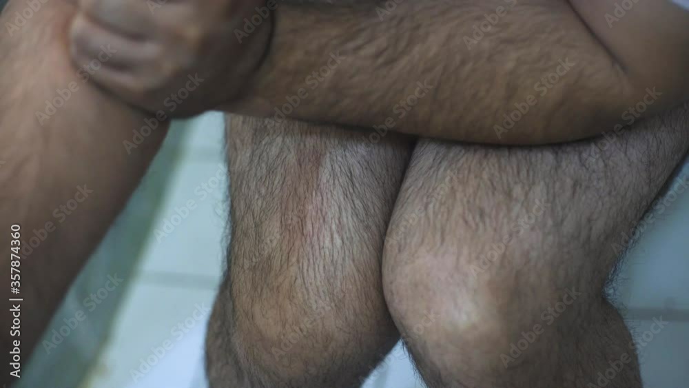 Man with hemorrhoids sitting in the toilet bowl. In the bathroom, VC. Unhappy with constipation, diarrhea, food poisoning, health and medical concepts. Painful scene Man with hemorrhoids sitting in the toilet bowl. In the bathroom, VC. Unhappy with constipation, diarrhea, food poisoning, health and medical concepts. Painful scene