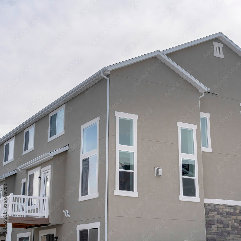 Square Townhouses exterior with small balconies at the facade in South Jordan Utah Square Townhouses exterior with small balconies at the facade in South Jordan Utah