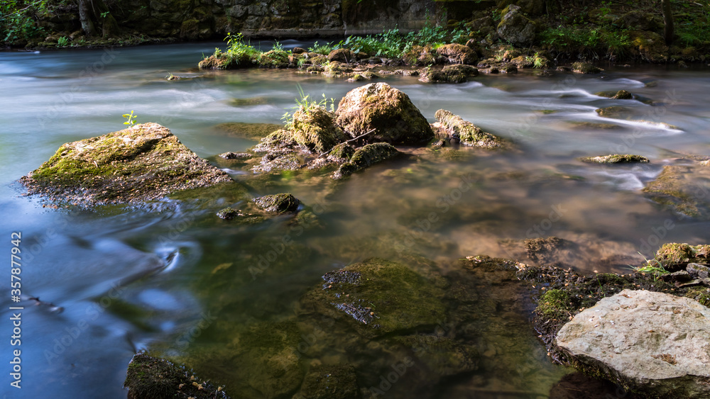 Warm light on river rocks