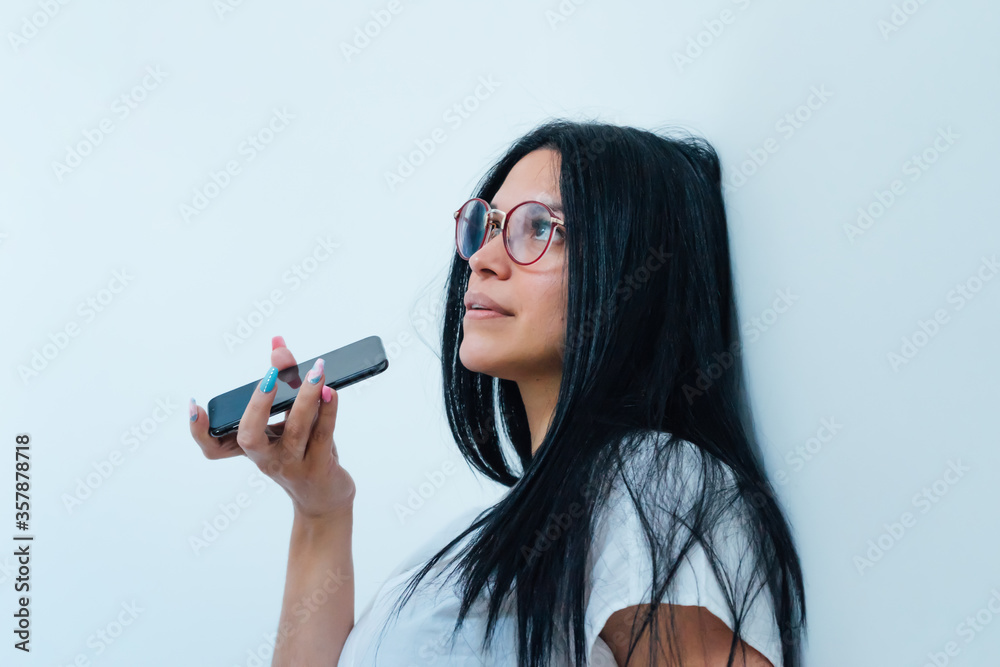 Woman sending a voice message on the phone Woman sending a voice message on the phone