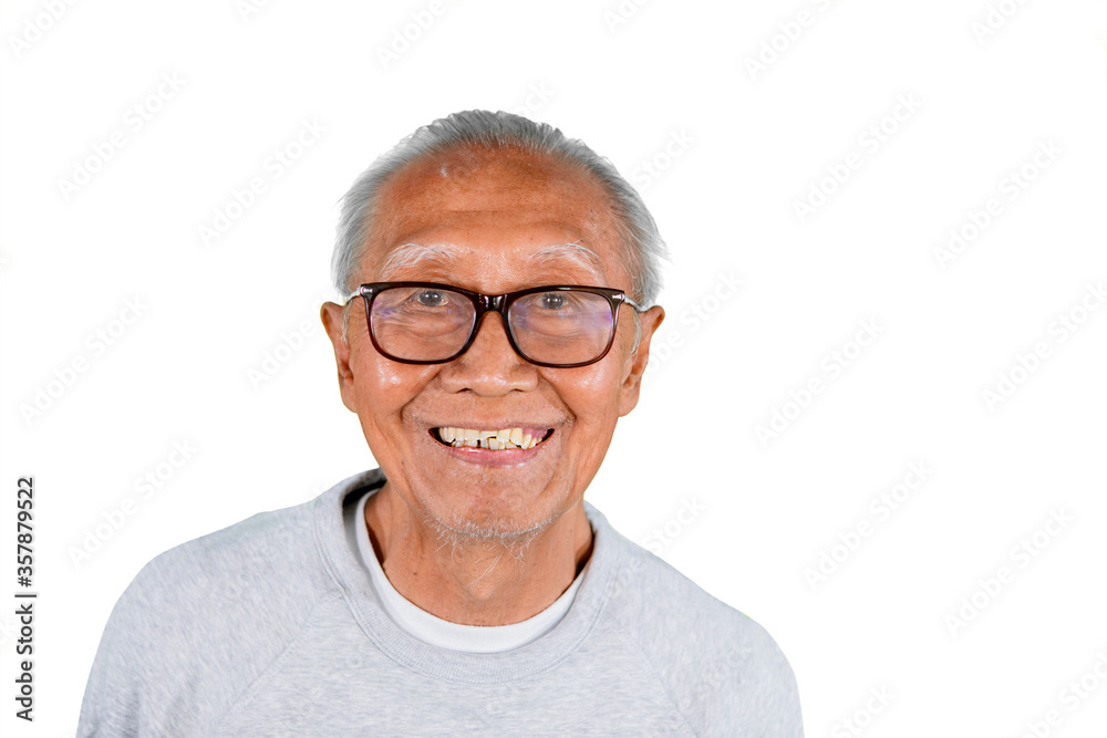 Old man wears eyeglasses while smiling at camera Old man wears eyeglasses while smiling at camera