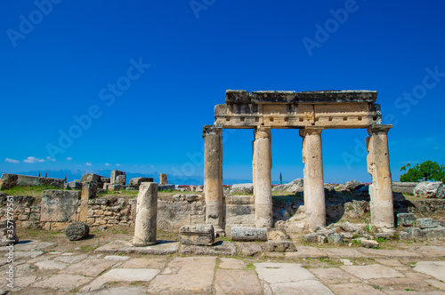 Close view on ancient columns and its elements in antique city Hierapolis, Pamukkale, Turkey.