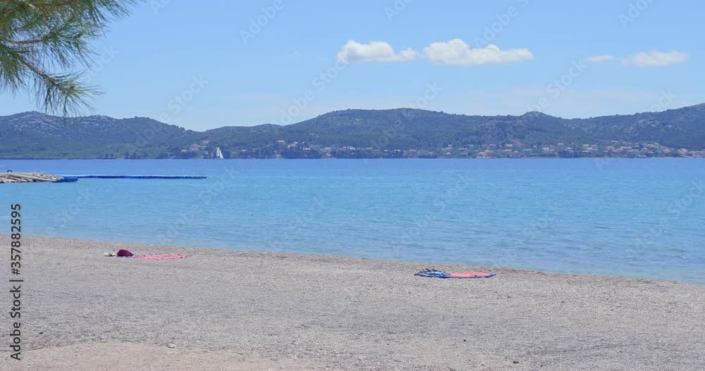 Towels without tourists on an empty beach. Summer 2020. Bad season due to Covid-19 Coronavirus.
Towels without tourists on an empty beach. Summer 2020. Bad season due to Covid-19 Coronavirus.