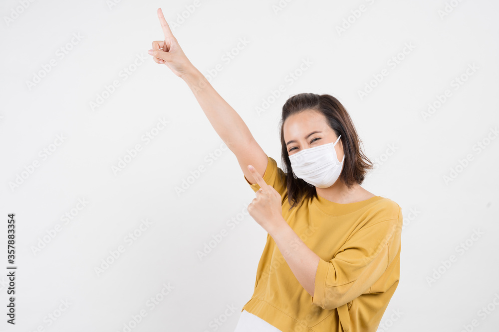 Young Asian woman wearing hygienic mask to prevent infection corona virus Air pollution pm2.5 she wearing a yellow T-shirt shoot in shot isolated on white background Young Asian woman wearing hygienic mask to prevent infection corona virus Air pollution pm2.5 she wearing a yellow T-shirt shoot in shot isolated on white background