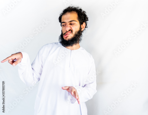 Muslim arabic man angry on someone and pointing at hiom with ang photo