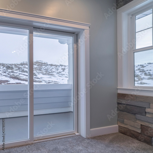 Square View through glass balcony doors of snow in winter