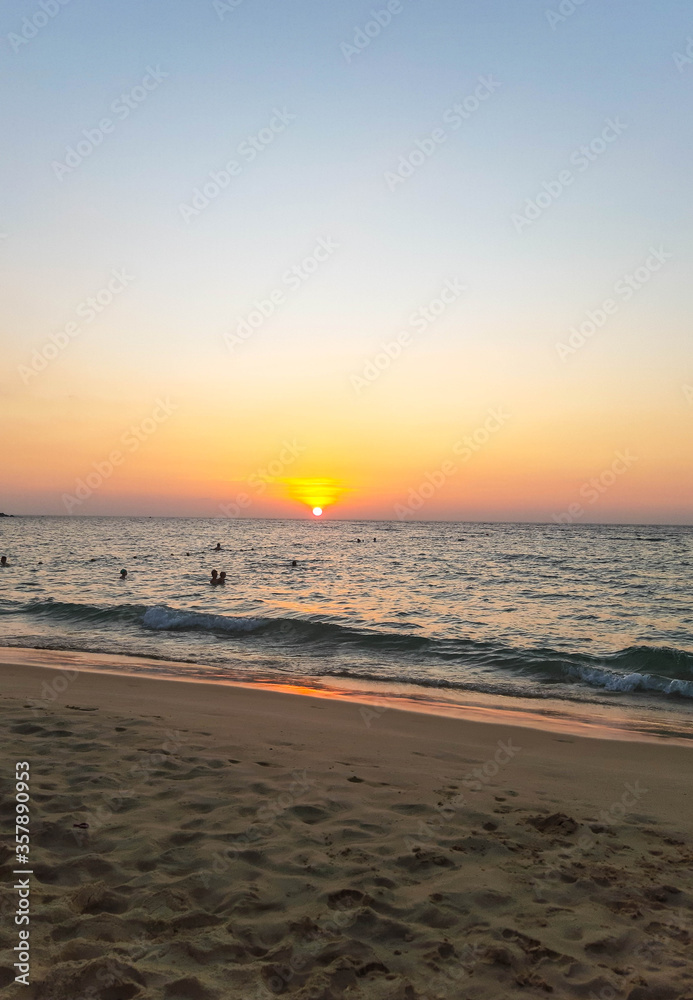 Sandy coastline and sunset. Summer vacation in Thailand.