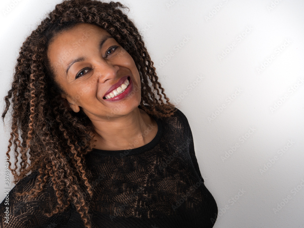 African American woman looking happy and confident African American woman looking happy and confident