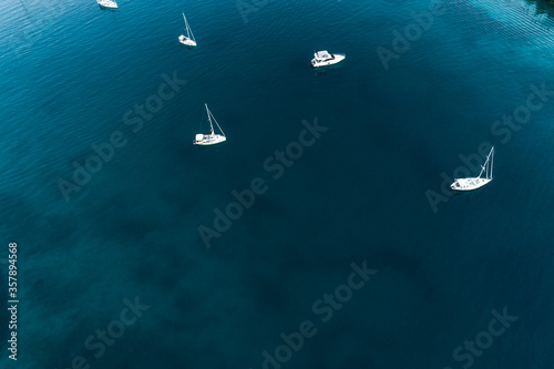 Boats on calm sea water with water texture © Teo