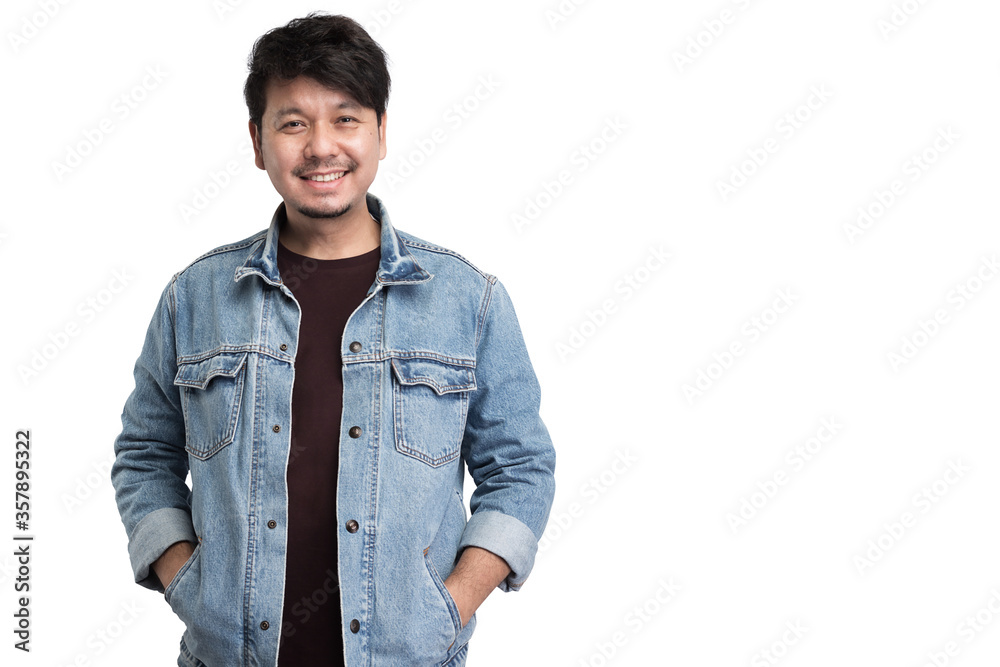 Smiling Asian man wear jacket jeans put the hand in pocket and look at camera, studio light portrait isolated on white background Smiling Asian man wear jacket jeans put the hand in pocket and look at camera, studio light portrait isolated on white background