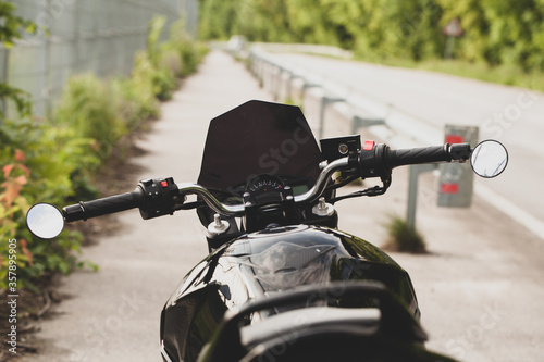 Black motorcycle close-up on the street.