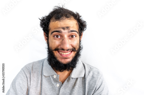 Arabic man with coal on his face having a bad day