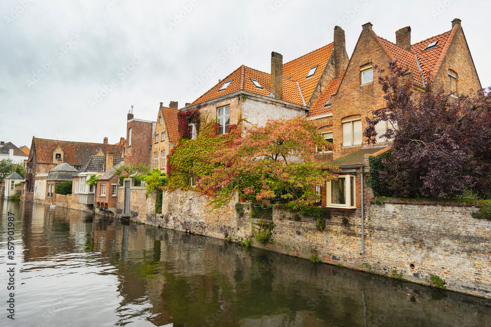 Cityscape of Bruges. Beautiful canal and traditional houses in the old town. Belgium, Europe.