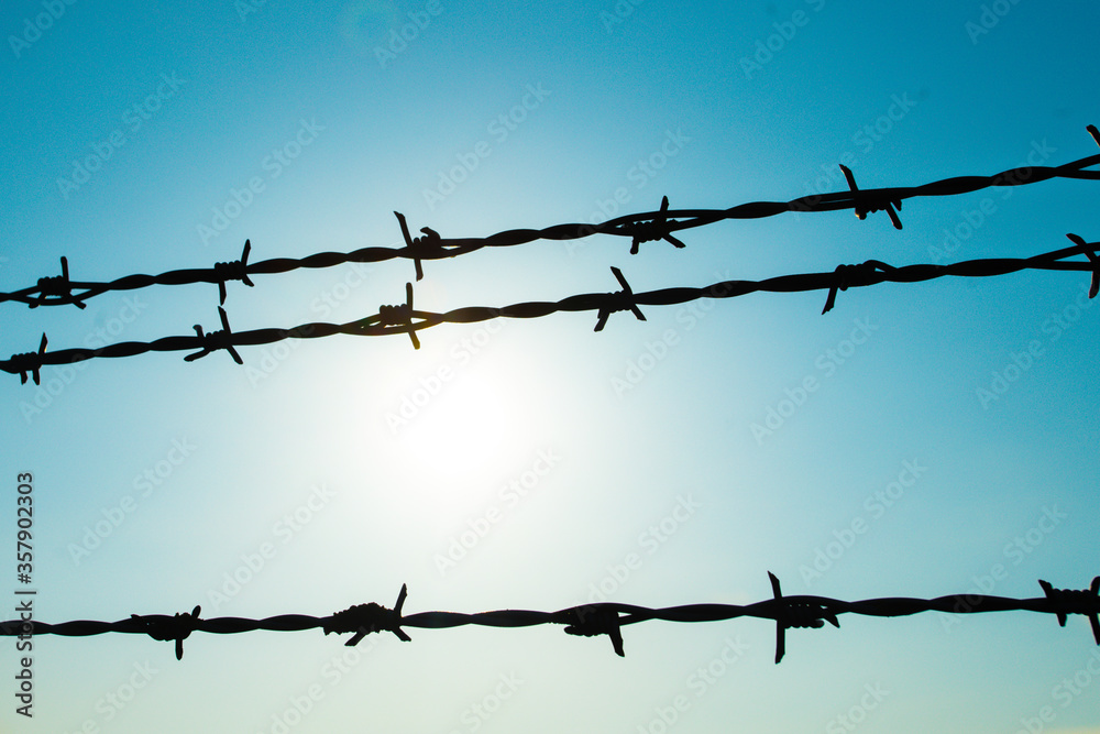 Background of barbed wire against the sky. Background of barbed wire against the sky.