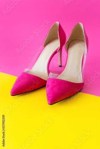 stylish pink high heels shoes on yellow and pink background. Shoes, fashion, style, shopping, sale concept