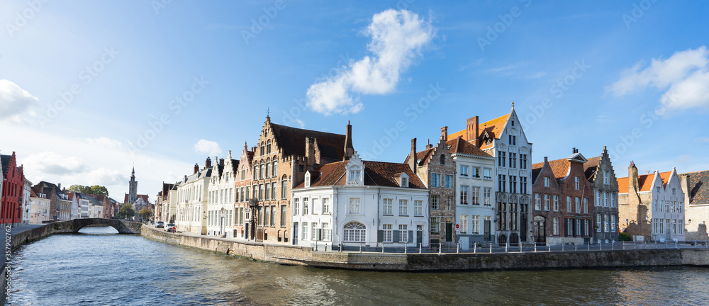 Cityscape of Bruges. Beautiful canal and traditional houses in the old town. Banner and panoramic edition.