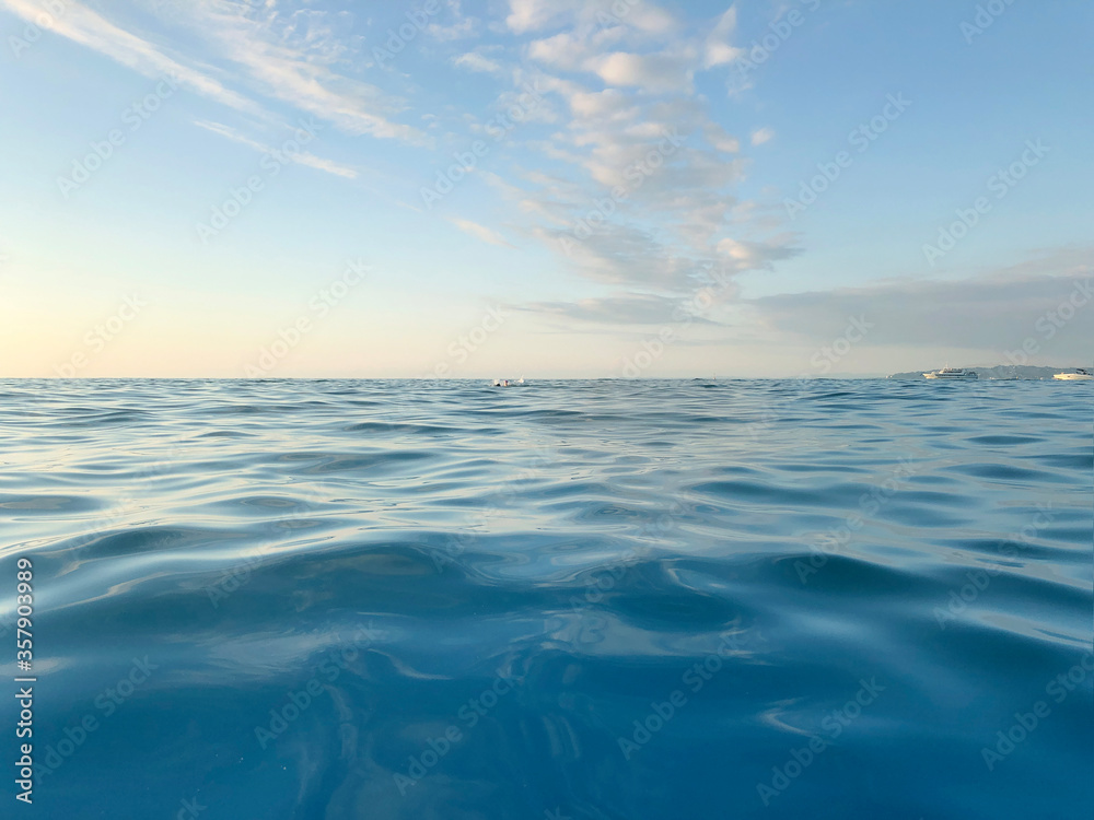 Obraz premium Blue Sea wave and cloud sky. Relax Nature water background.