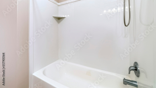 Panorama Close up of bathroom bathtub with stainless steel shower head and faucet