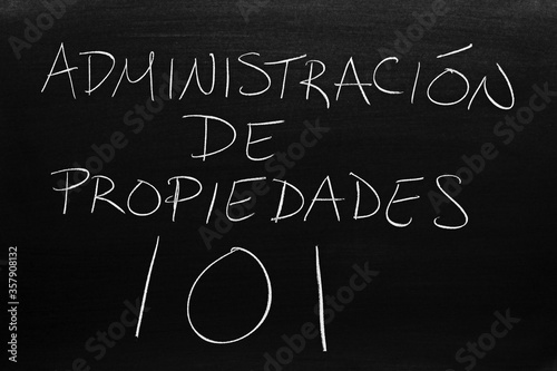 The words Administración De Propiedades 101 on a blackboard in chalk.  Translation: Property Mangement 101 photo