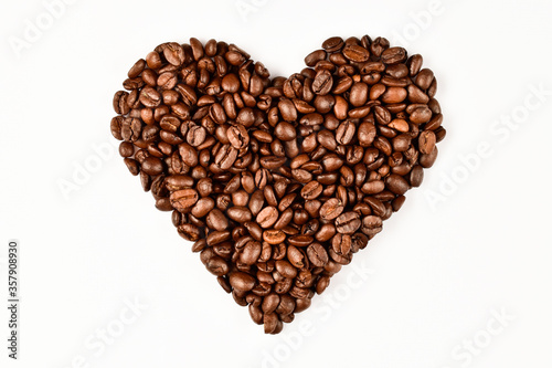 Heart made of coffee beans. Love concept of coffee beans. Isolated on white background.