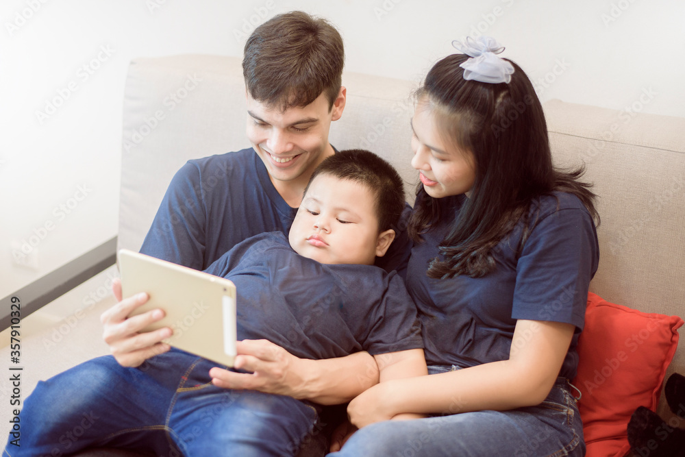 Happy family are enjoying on sofa at home, Safety home activity concept Happy family are enjoying on sofa at home, Safety home activity concept