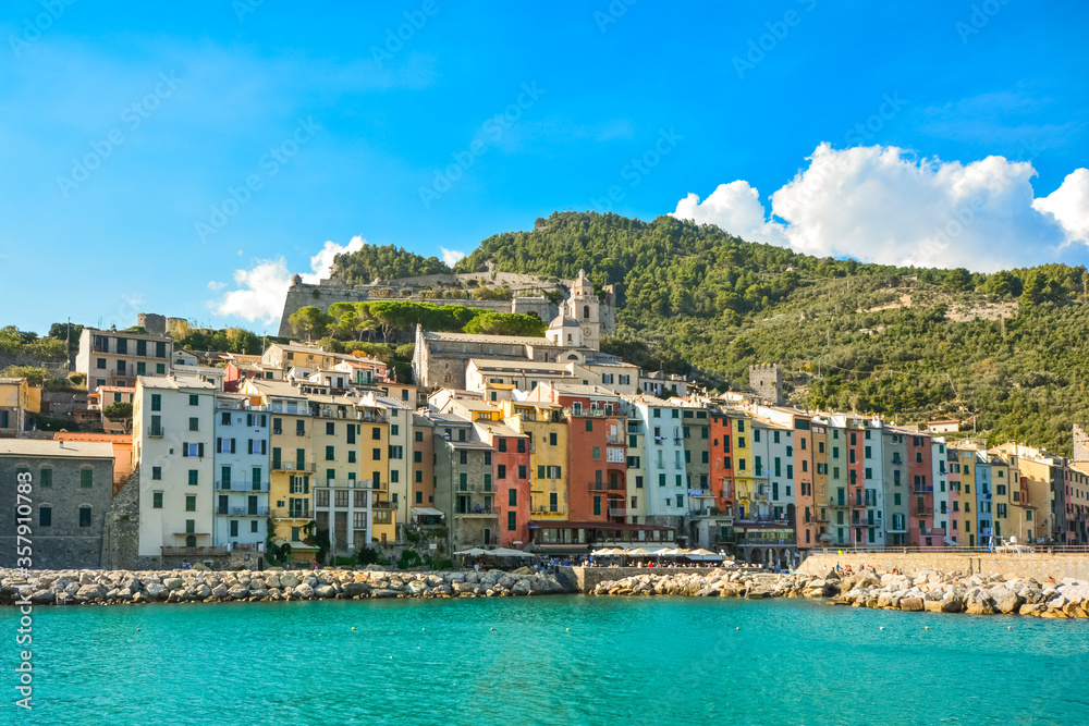 The colorful coastal village of Porto Venere, Italy, on the Ligurian coast, with it's sidewalk cafes, shops and marina.