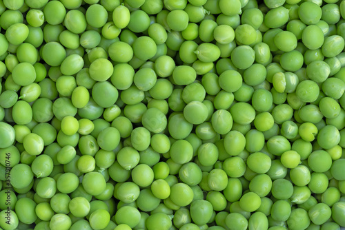 fresh green peas background texture top view © izikmd