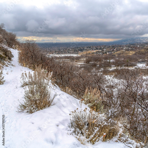 Square Snowy Provo Canyon mountain in winter overlooking the valley and overcast sky