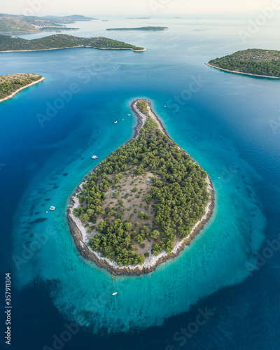 Vertical shot of an island in form of a drop 