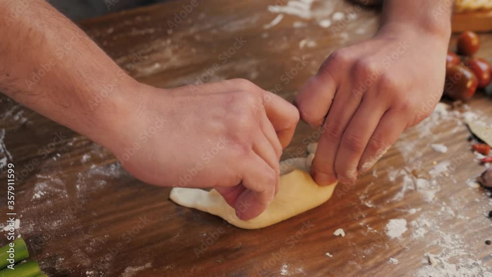 Man cooking empanadas argetinian pie, traditional bakery from argentina, chef filling dough in home with meat and vegetables, homemade spanish empanadas Man cooking empanadas argetinian pie, traditional bakery from argentina, chef filling dough in home with meat and vegetables, homemade spanish empanadas