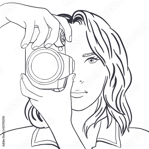 A young lady photographer takes photos covering half of her face with a camera illustration in grey