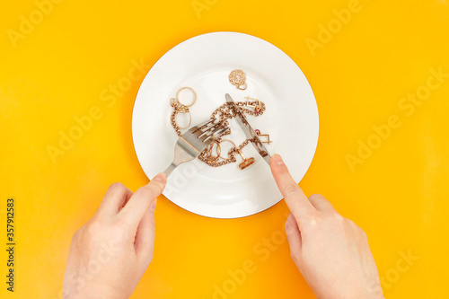 Woman eats gold jewelry. Eating disorder: Pica, Picacism, Parorexia, Allotriophagy, Inedible concept. Unhealthy concept