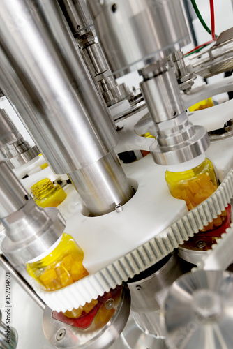 Pharmaceutical conveyor production of vitamins.