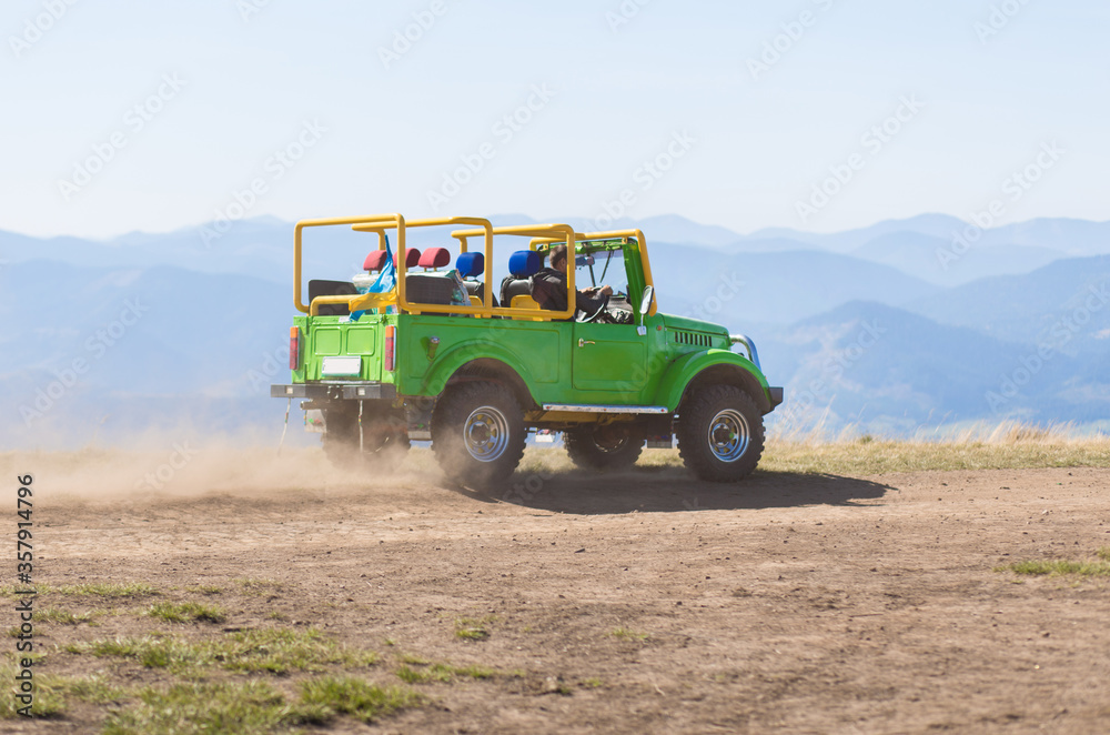 Pylypets, Ukraine - 15 September, 2019: Group of people travel by car on mountains top. Pylypets, Ukraine - 15 September, 2019: Group of people travel by car on mountains top.