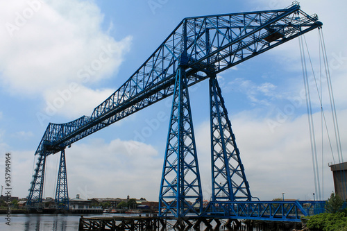 The Tees Transporter Bridge at Middlesbrough. Showing the gondola bridge and the surrounding dock area. © Nigel