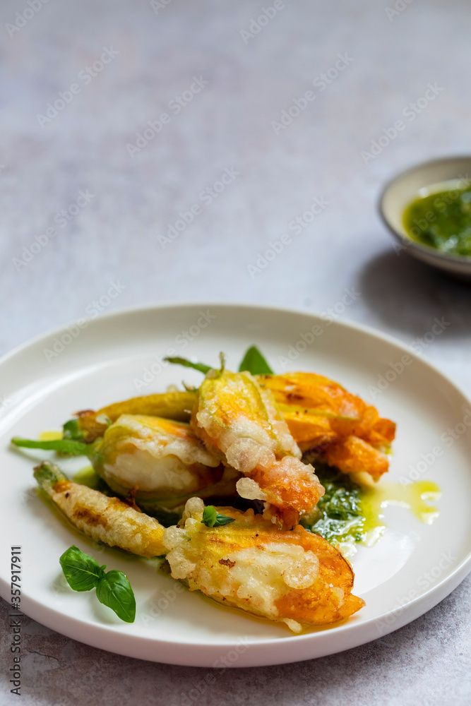 Fried courgette flowers stuffed with ricotta cheese in light tempura batter Fried courgette flowers stuffed with ricotta cheese in light tempura batter