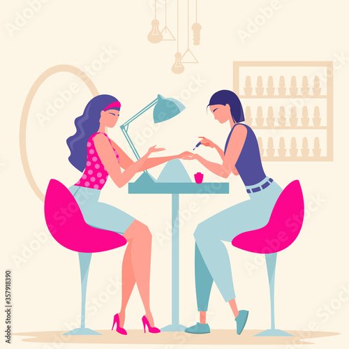 Beauty saloon. Girl makes a manicure to a client. A manicurist is talking to a girl.