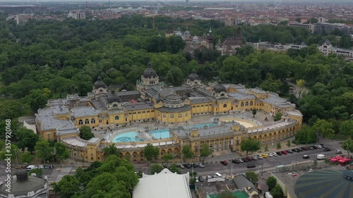 The Szechenyi Thermal Bath  in the Budapest city park. In the background are Vajdahunyad Castle and Heroes' Square. BUDAPEST, HUNGARY - JUN 11. 2020.