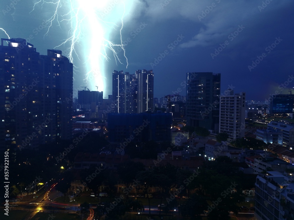 Fototapeta premium Thunderstorm over Singapore at night - October 2017