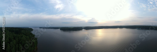 panoramic view of the river with floating boats and beautiful clouds shot from a drone