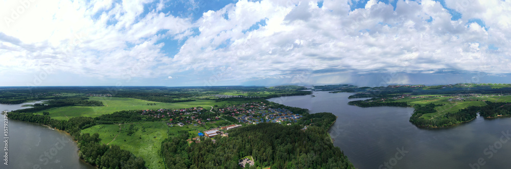 panoramic view of the river with floating boats and beautiful clouds shot from a drone panoramic view of the river with floating boats and beautiful clouds shot from a drone
