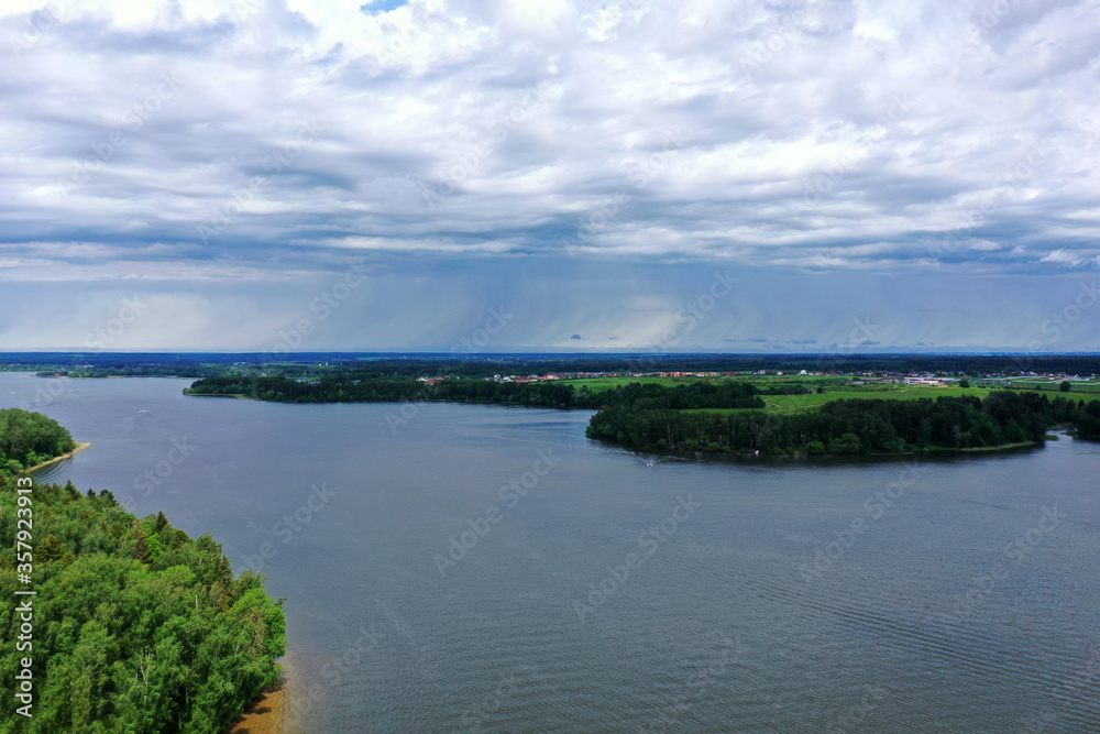 panoramic view of the river with floating boats and beautiful clouds shot from a drone