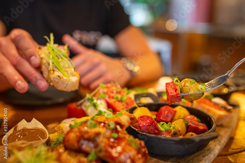 Tapas platter on a table being eaten at a Spanish restaurant