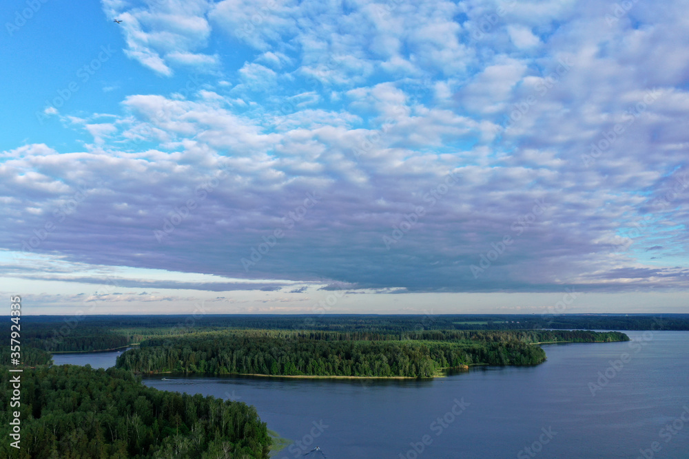 panoramic view of the river with floating boats and beautiful clouds shot from a drone