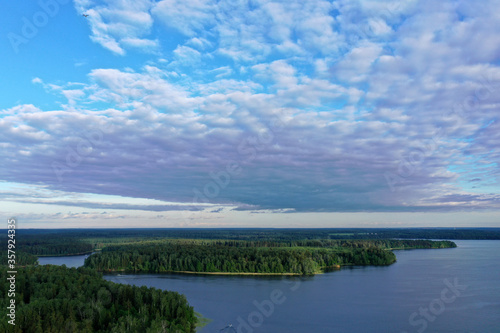 panoramic view of the river with floating boats and beautiful clouds shot from a drone © константин константи