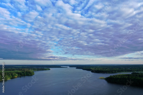 panoramic view of the river with floating boats and beautiful clouds shot from a drone