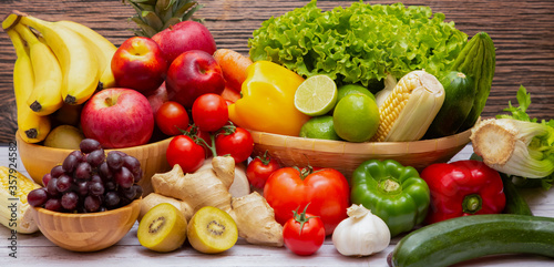 Assortment of Fresh vegetables and fruits background,Healthy food © Bussarin